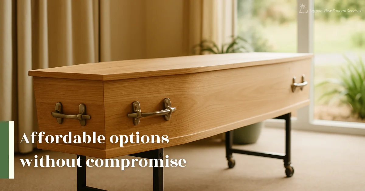 Simple wooden casket displayed in a softly lit funeral room.